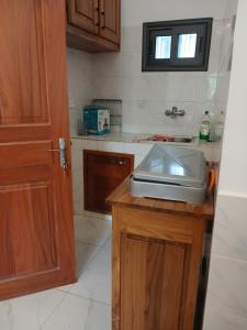 a kitchen with a counter with a toaster on it at Studio Lac Rose in Abomey-Calavi