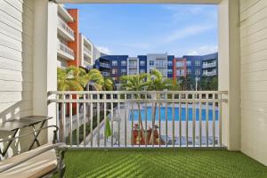 a balcony with a view of the pool at Stylish 2BR w Balcony, Pool & Pet-Friendly #15 in Tampa