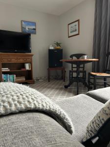 a living room with a couch and a table at Caistor Bed & Breakfast in Caistor