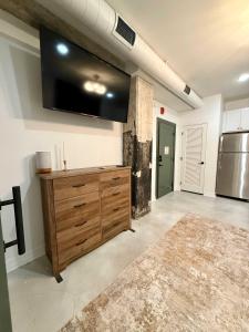 a large kitchen with a large tv on the wall at Park Hotel Studio Suite 207 in Chattanooga