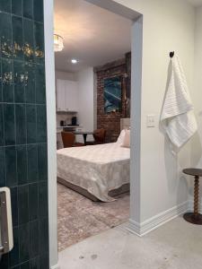 a bedroom with a bed and a dining room at Park Hotel Studio Suite 207 in Chattanooga +11 photos