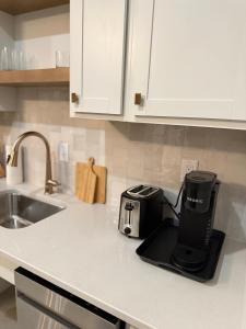 a kitchen counter with a coffee maker on the counter at Park Hotel Studio Suite 207 in Chattanooga