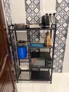 a shelf with a computer on it in a room at النبلا الذهبي in Medina +20 photos