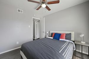 a bedroom with a bed with a ceiling fan at Bright two-bed wupgraded fixtures in Denton +12 photos