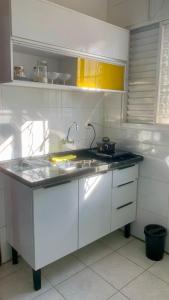 a kitchen with a sink and a counter top at Kitnet Equipada in Sao Jose do Rio Preto