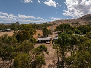 an aerial view of a house in the middle of trees at Nanda Lake House in Bonnie Doon +12 photos