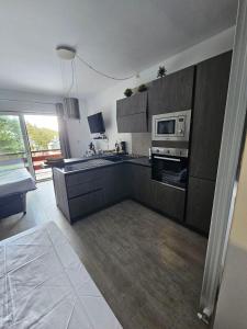a kitchen with a stove and a microwave at BENNY'S MOUNTAIN b&b in Pescocostanzo +22 photos