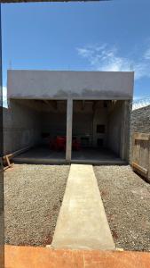 a building under construction with a garage at Casa privativa Próximo a Itaipu in Foz do Iguaçu