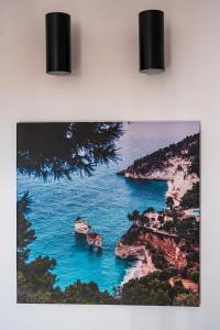 a painting of a view of the ocean at B&B Arcolobello ApartHotel in Corato