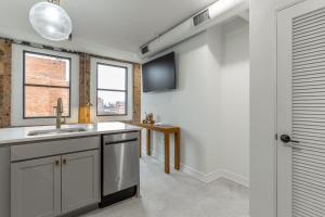 a kitchen with a sink and a window at Park Hotel 1BR Suite 402 in Chattanooga
