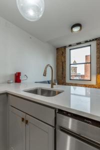 a kitchen with a sink and a window at Park Hotel 1BR Suite 402 in Chattanooga
