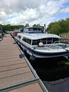 a boat docked at a dock in the water at Hidden gem in Invernisk +19 photos