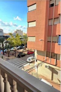 a view from a balcony of a parking lot at Estudio a 5 minutos del Aeropuerto in Torrellano +8 photos