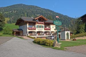 a large building on the side of a mountain at Hotel Garni Ransburgerhof in Flachau