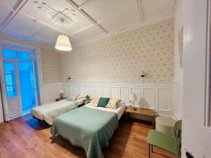 a bedroom with two beds in a room at Monte Sinai Guest House in Porto