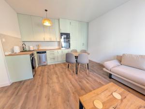 a living room with a couch and a table at Apartament Podgórze Wałbrzych in Wałbrzych