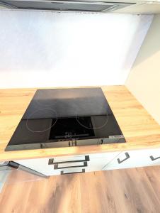 a tv sitting on top of a table in a room at Apartament Podgórze Wałbrzych in Wałbrzych