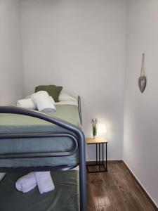 a bedroom with a bunk bed and a side table at Pinedo Playa Holiday in Valencia