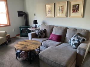 a living room with a couch and a table at Berkshire House Stay in Lee