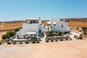 an aerial view of a house in the desert at Louros rooms in Koufonisia