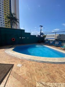 a swimming pool on top of a building at Natal Plaza Hotel in Natal