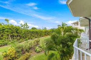 a view from the balcony of a house with palm trees at Royal Apartment 223 in Saint James