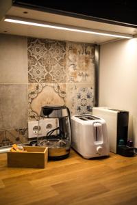 a kitchen counter with a toaster and a toaster at Canoa Studio Vlc & Free filtered drinking water in Valencia