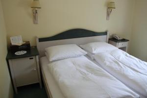 Krevet ili kreveti u jedinici u okviru objekta Hotel Seewinkel