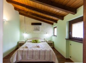 Ένα ή περισσότερα κρεβάτια σε δωμάτιο στο Agriturismo alla Poncia