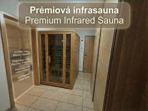 a sign that reads pirmula imperiusiana premium insulated sauna in at Apartmán Benedikt - soukromá zahrádka in Vrchlabí