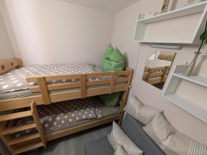 a room with two bunk beds and a chair at Bocksbergbande in Goslar +51 photos