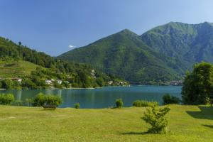 a view of a lake with mountains in the background at Apartments in Pieve di Ledro - Ledrosee 22645 in Ledro