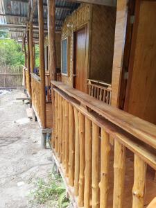 a row of wooden decks on a house at C and C Place in San Vicente