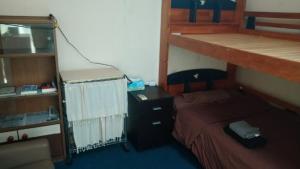 a bedroom with a bunk bed and a desk at BigJoy IN 2000 男性専用ドミトリーレンタル店2F ONLY MEN in Miyako-jima +4 photos