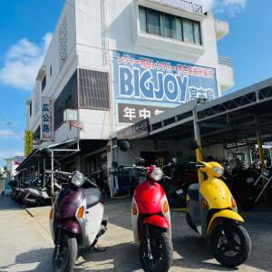 two motor scooters parked in front of a building at BigJoy IN 2000 男性専用ドミトリーレンタル店2F ONLY MEN in Miyako-jima
