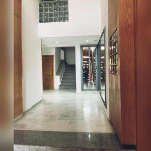 a hallway of a home with a staircase and a stair case at إقامة حسن in Fez