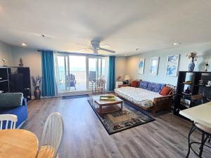 a living room with a couch and a table at Beachfront Condo with Amazing Ocean Views 4th Fl in Old Orchard Beach +15 photos