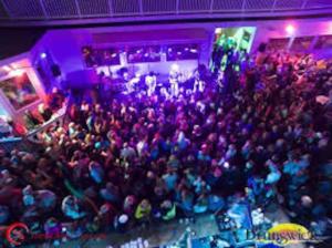 a large crowd of people standing in a room at Beachfront Condo with Amazing Ocean Views 4th Fl in Old Orchard Beach