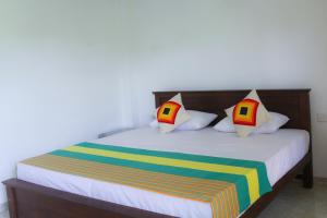 Giường trong phòng chung tại Paddy Field View Resort