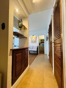 a hallway with a kitchen and a living room at Casa Boho in Angers