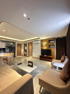 a living room with a couch and a table at One Euphoria Luxe Hotel in Angeles