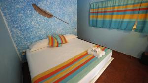 Llit o llits en una habitació de Zipoliteville - HOTEL NUDISTA