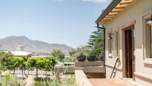 a balcony with a view of the mountains at Hotel Boutique con Desayuno in Tafí del Valle +49 photos