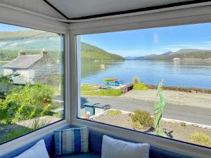 a view of a lake from a window at The Heron in Ardentinny