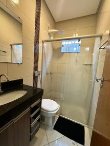 a bathroom with a shower and a toilet and a sink at maray house complete elegance very well located in Formosa +42 photos