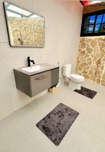 a bathroom with a sink and a toilet at Light Star Villa in Kuta Lombok +68 photos