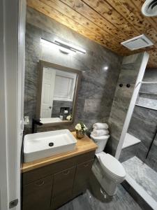 a bathroom with a sink and a toilet and a shower at Beautiful house in Augusta in Augusta +31 photos