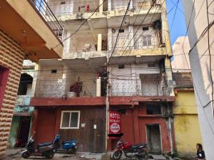 two motorcycles parked in front of a building at SPOT ON HOTEL MOONLIGHT in Bhilai