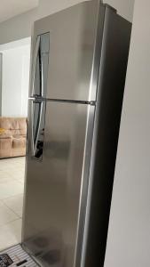 a stainless steel refrigerator in a kitchen at Downtown apartment in Sinop