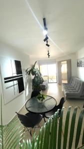 a living room with a table and a couch at Cabrero Beach 1212 in Cartagena de Indias